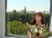 Sherri with the flowers in the hotel room